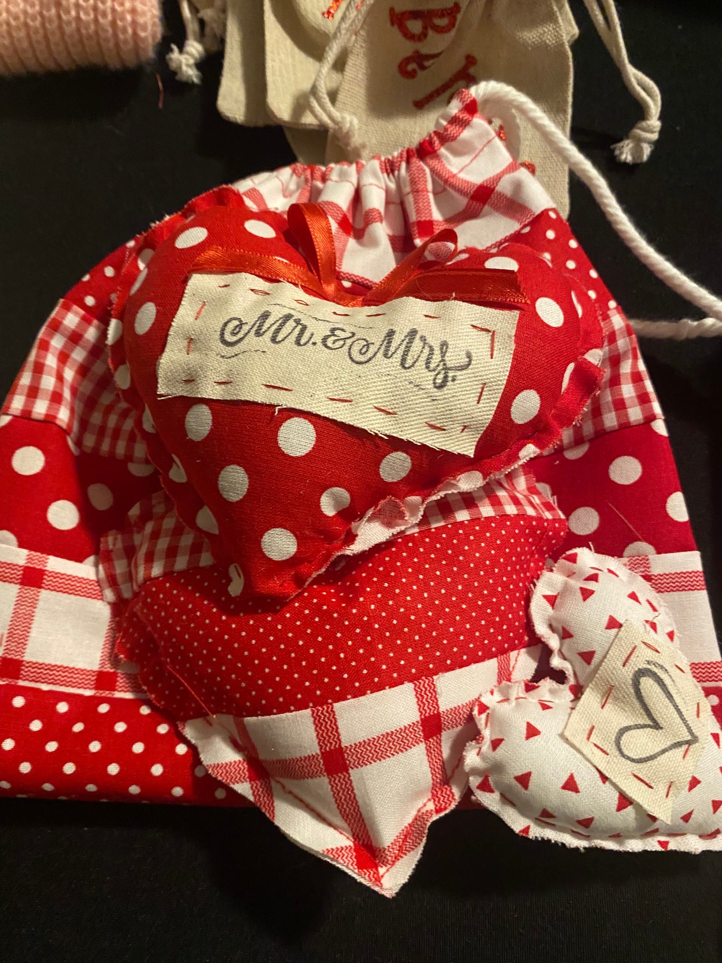 Handmade Fabric Bag with 3 matching fabric hearts.